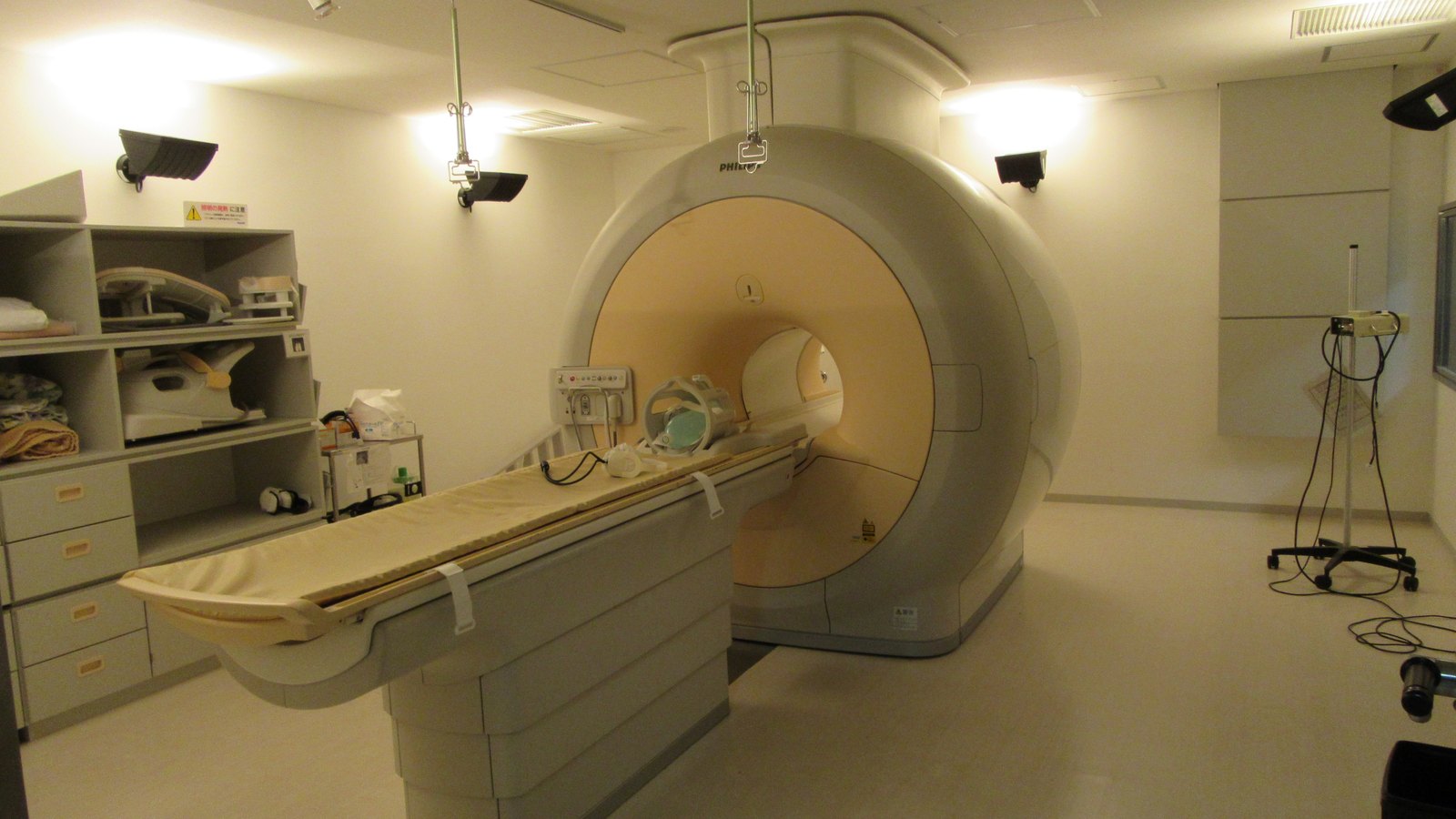 An MRI scanner with its patient table in a hospital room